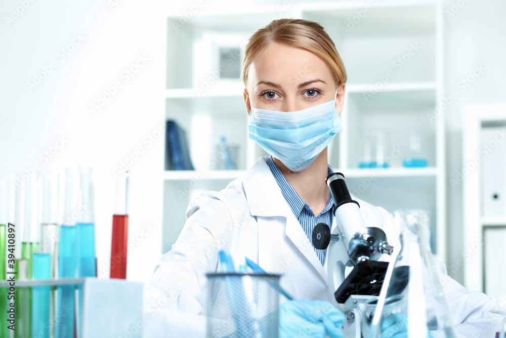 Young scientist working in laboratory Young scientist working in laboratory