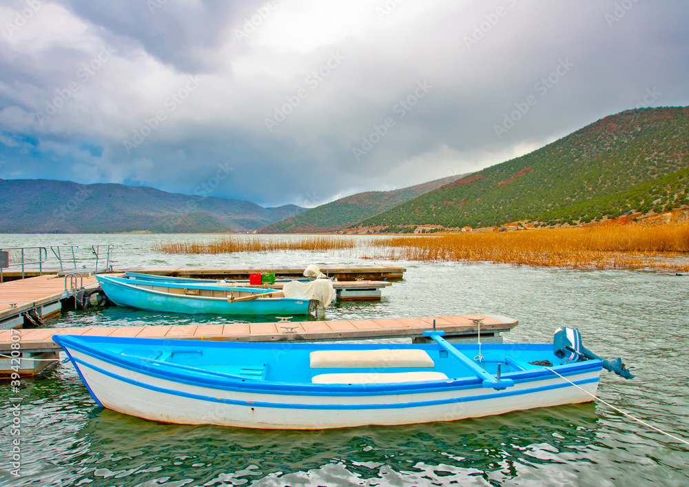 Old wooden fishing boats in the lake Prespa in Greece.