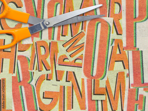 Cut letters and scissors background