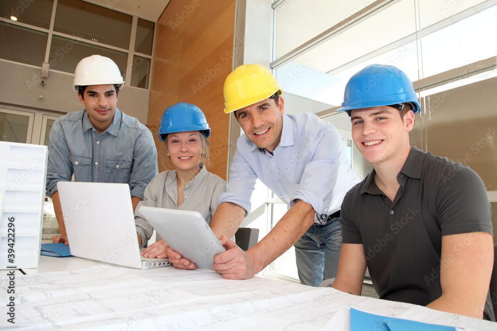 Students in architecture working on electronic tablet Students in architecture working on electronic tablet