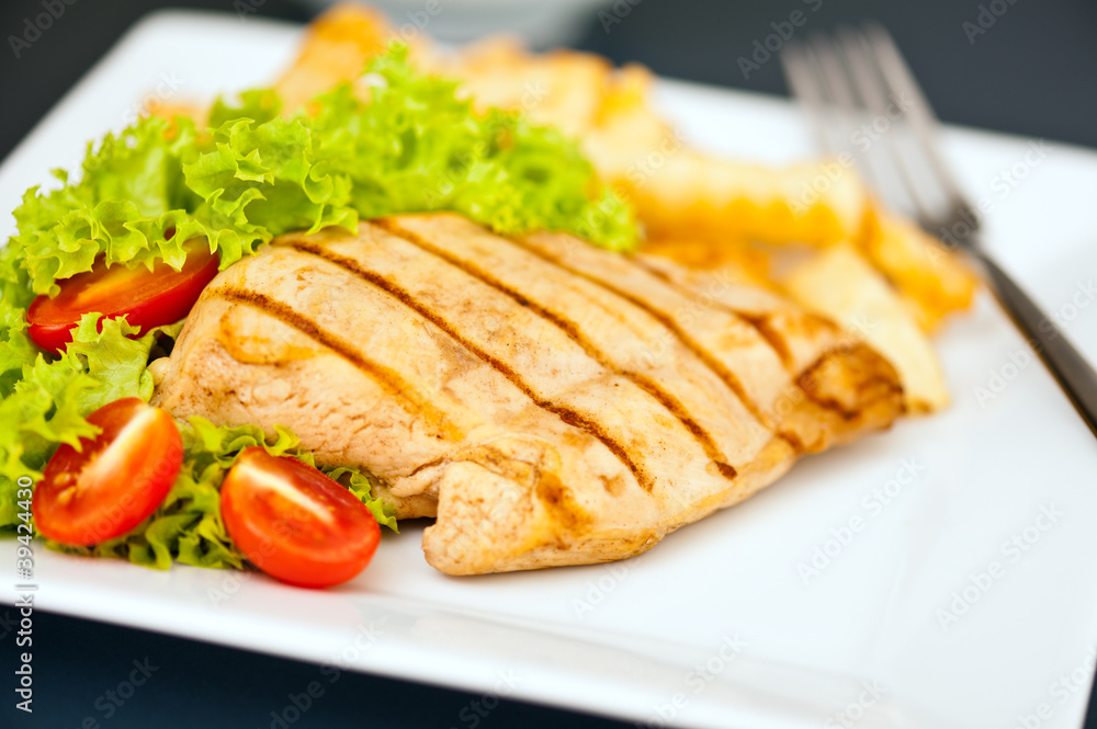 Chicken, French fries and salad