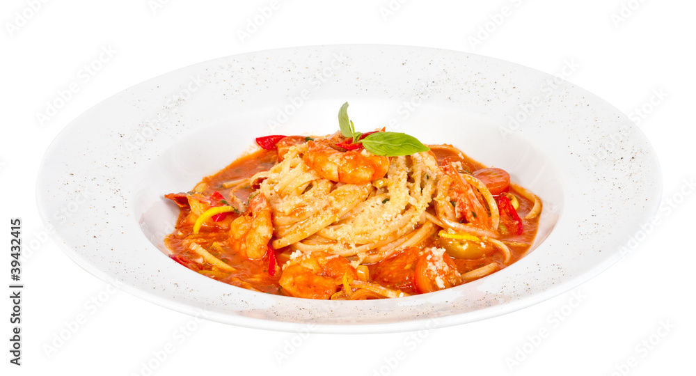 A plate of linguini with sauteed shrimp, tomato, chili and oliv A plate of linguini with sauteed shrimp, tomato, chili and oliv