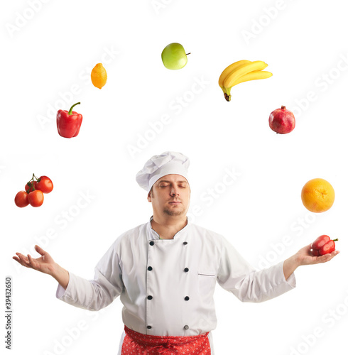 chef juggles fruit and vegetables with  eyes closed