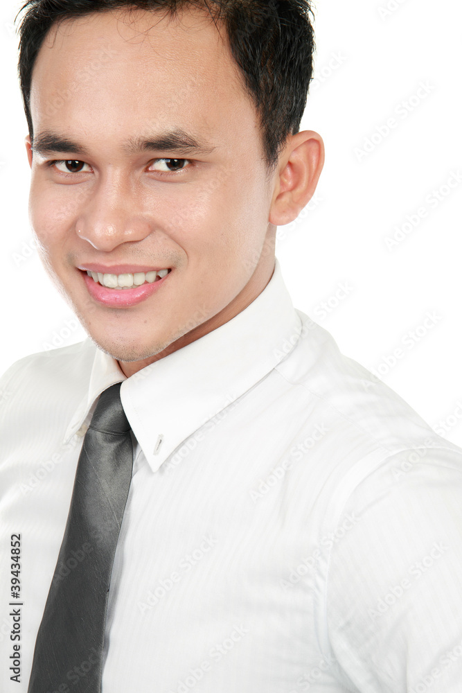 Closeup portrait of a happy young asian business man smiling Closeup portrait of a happy young asian business man smiling