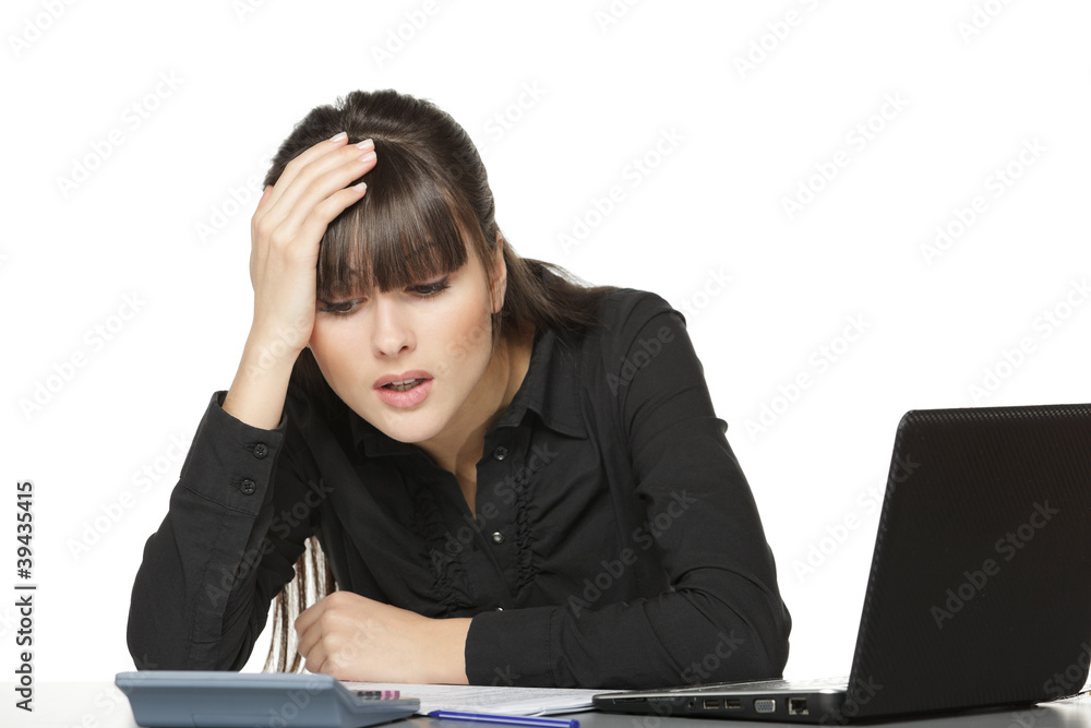 Business woman calculating at office Business woman calculating at office