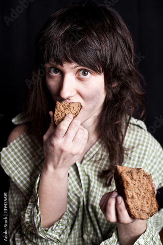 beggar woman eating bread