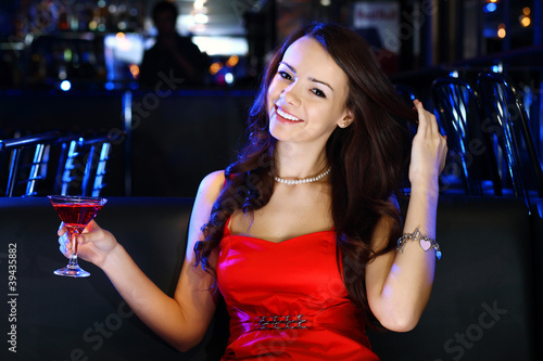 Attractive woman in night club with a drink © Sergey Nivens