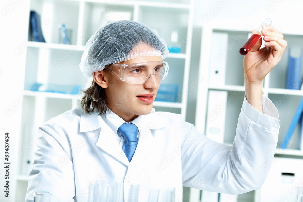 Young scientist working in laboratory Young scientist working in laboratory