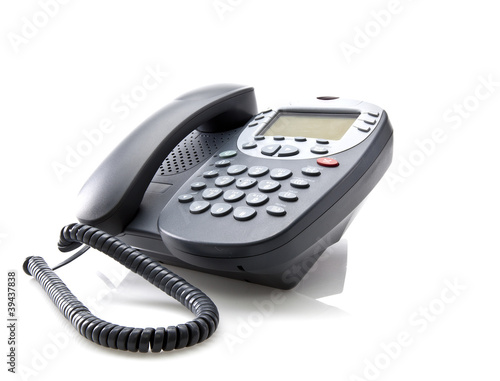 Gray office telephone isolated on a white background