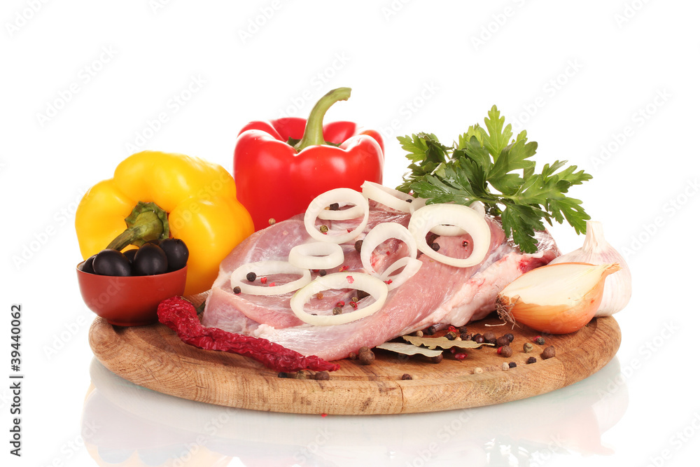 Raw meat and vegetables on a wooden board isolated on whitе Raw meat and vegetables on a wooden board isolated on whitе