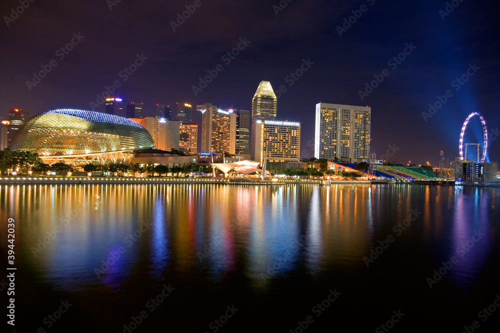 Skyscrapers' and other buildings reflection on water Skyscrapers' and other buildings reflection on water