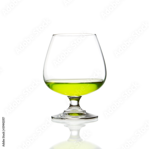 wine glass and green cocktail isolated