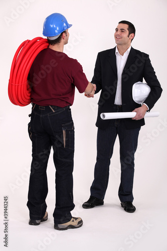 Tradesman and engineer meeting for the first time