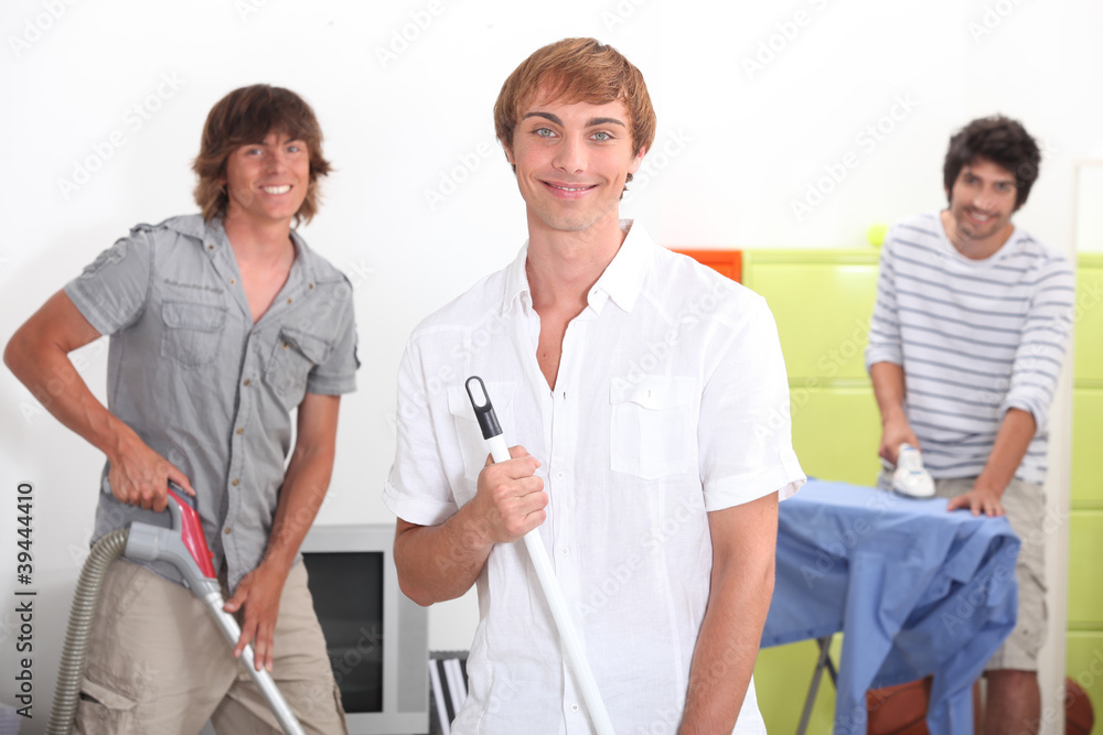 Young men doing household chores Young men doing household chores