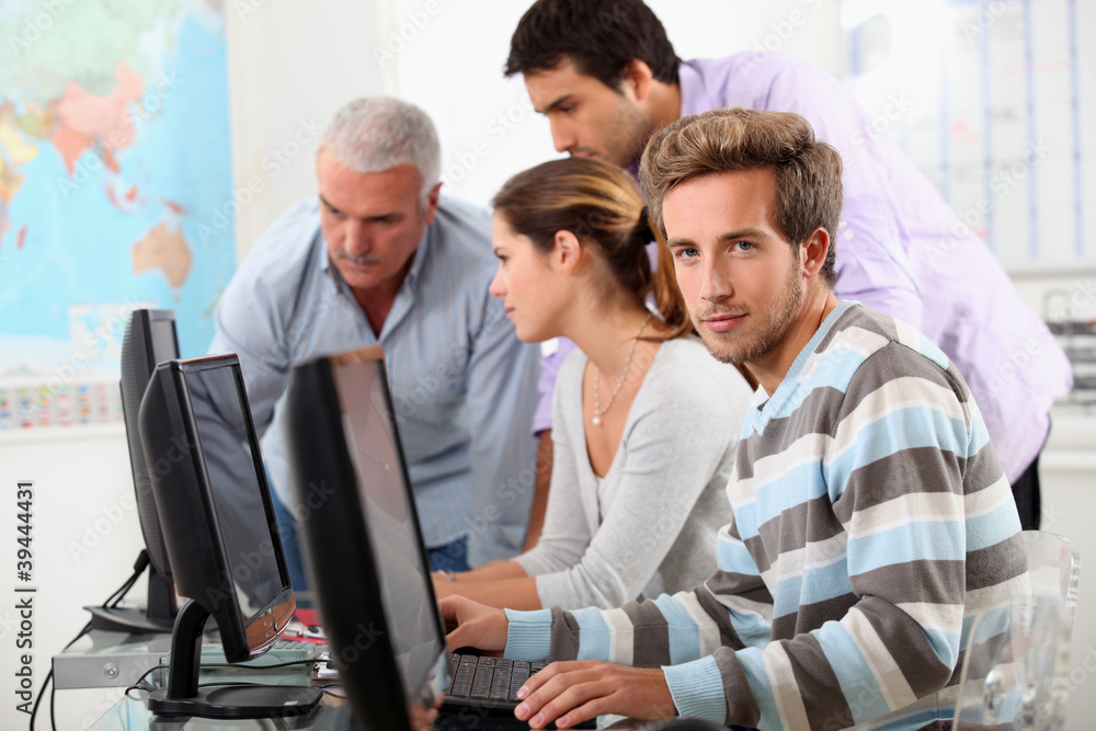 Mature students at computers Mature students at computers