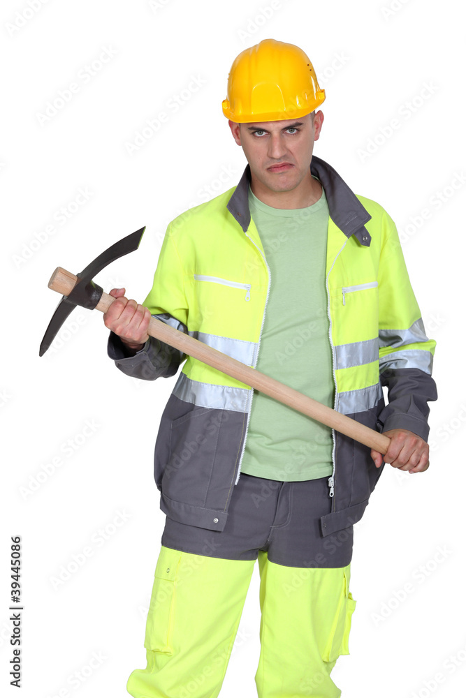 A man holding a pickaxe with a serial killer face. A man holding a pickaxe with a serial killer face.