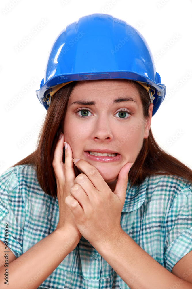 Indecisive woman in a hardhat Indecisive woman in a hardhat