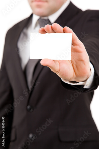 Business man offering card, isolated over white background