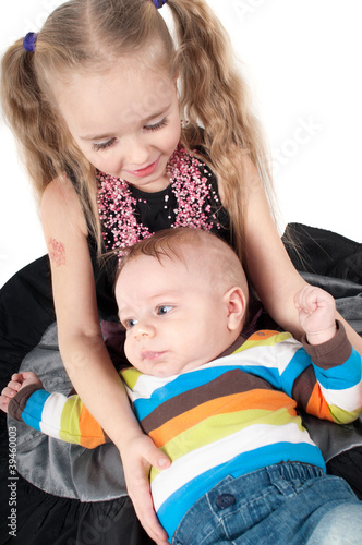 Newborn baby with sister photo