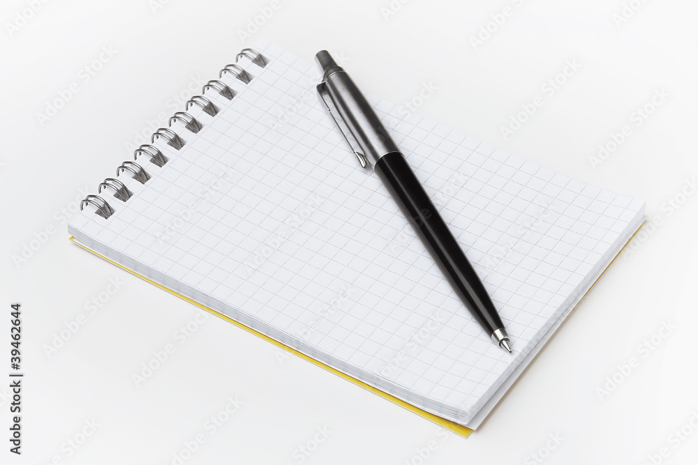 Notepad with pen isolated on white background Notepad with pen isolated on white background