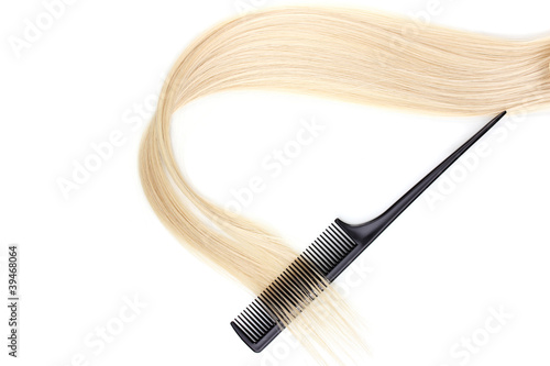 Shiny blond hair and comb isolated on white