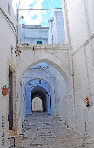 Street view in the beautiful white city of Ostuni, Italy © annavee
