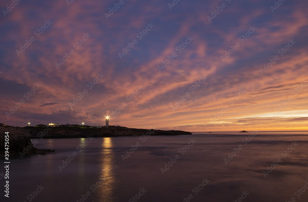 Naklejka premium Sunset with lighthouse
