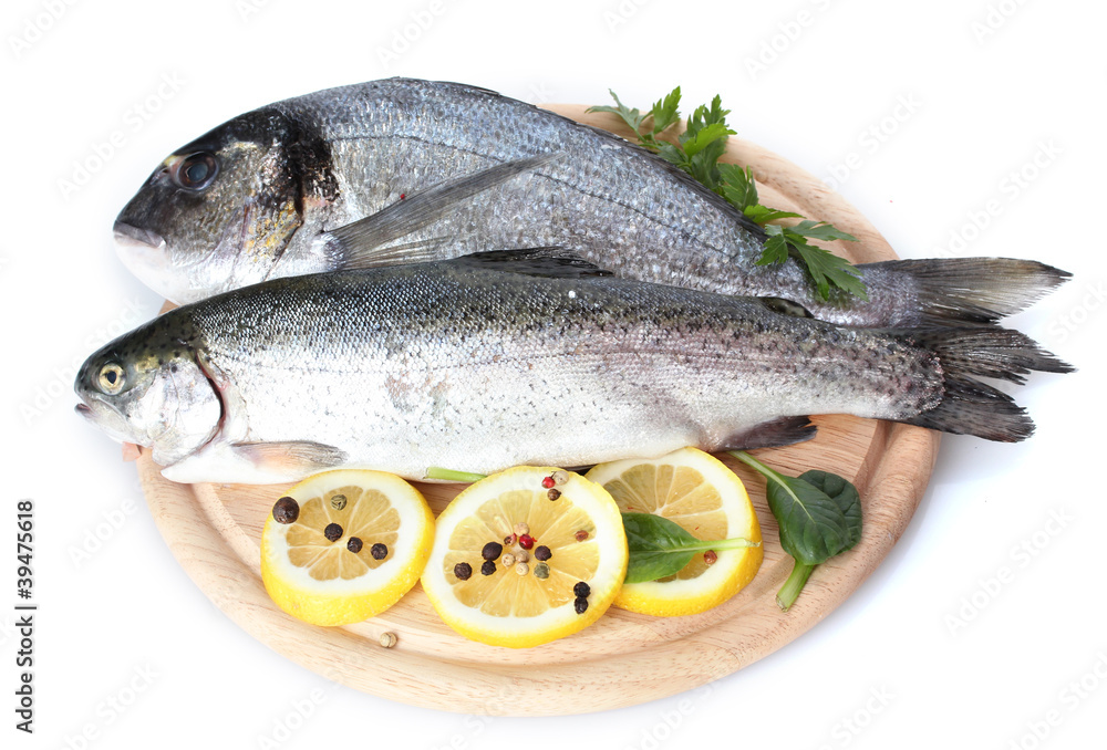 Fresh fishes with lemon, parsley and spice