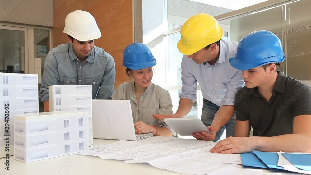 Educator with future architects working in class Educator with future architects working in class