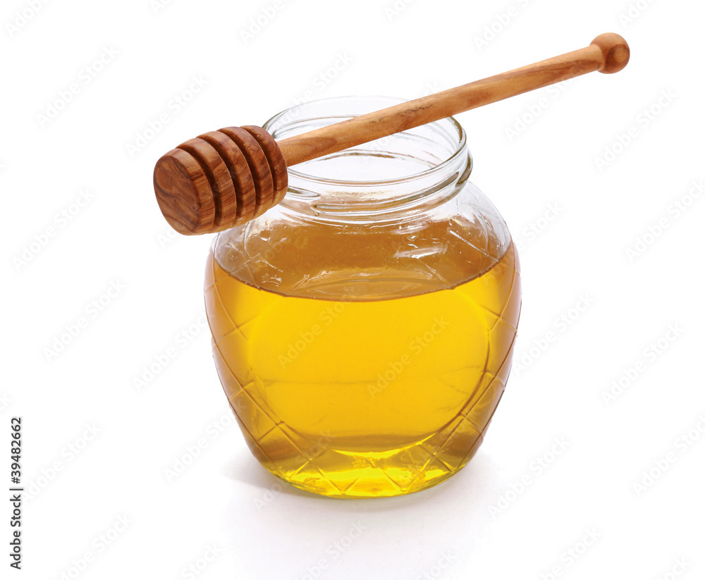 Honey with wood stick, isolated on white background Honey with wood stick, isolated on white background