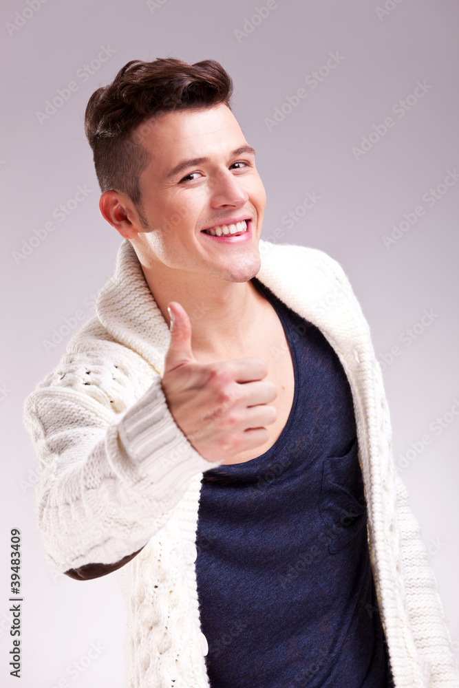 man showing thumbs up and smiling man showing thumbs up and smiling