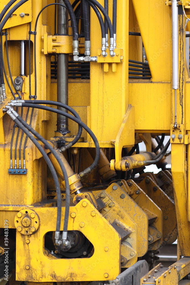 Abstract section of railroad industrial hydraulic equipment.