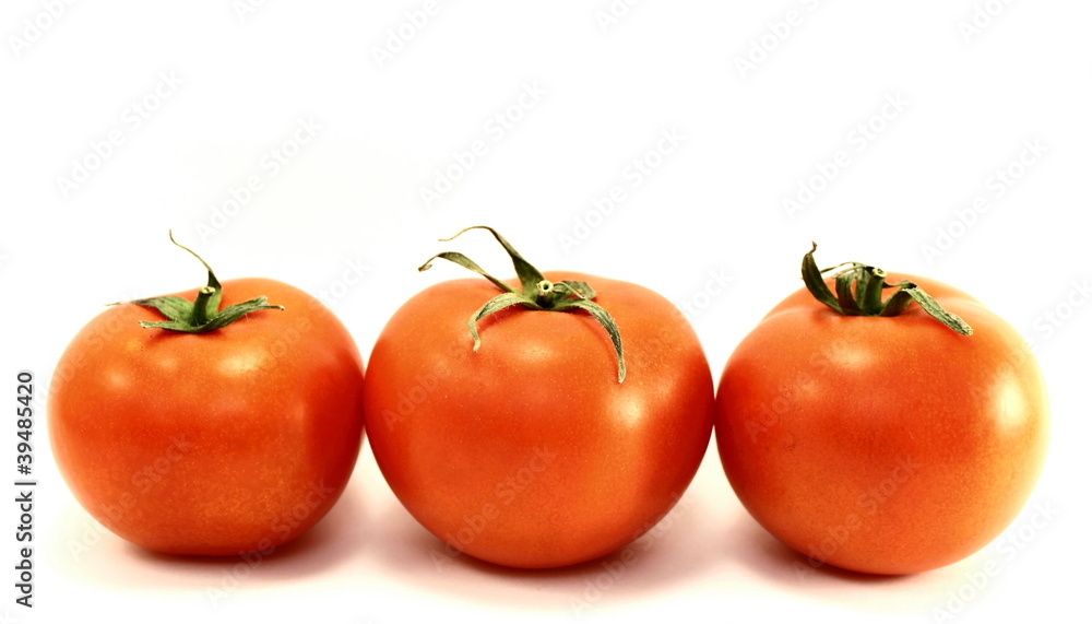 Juicy red ripe tomatoes on a white background Juicy red ripe tomatoes on a white background
