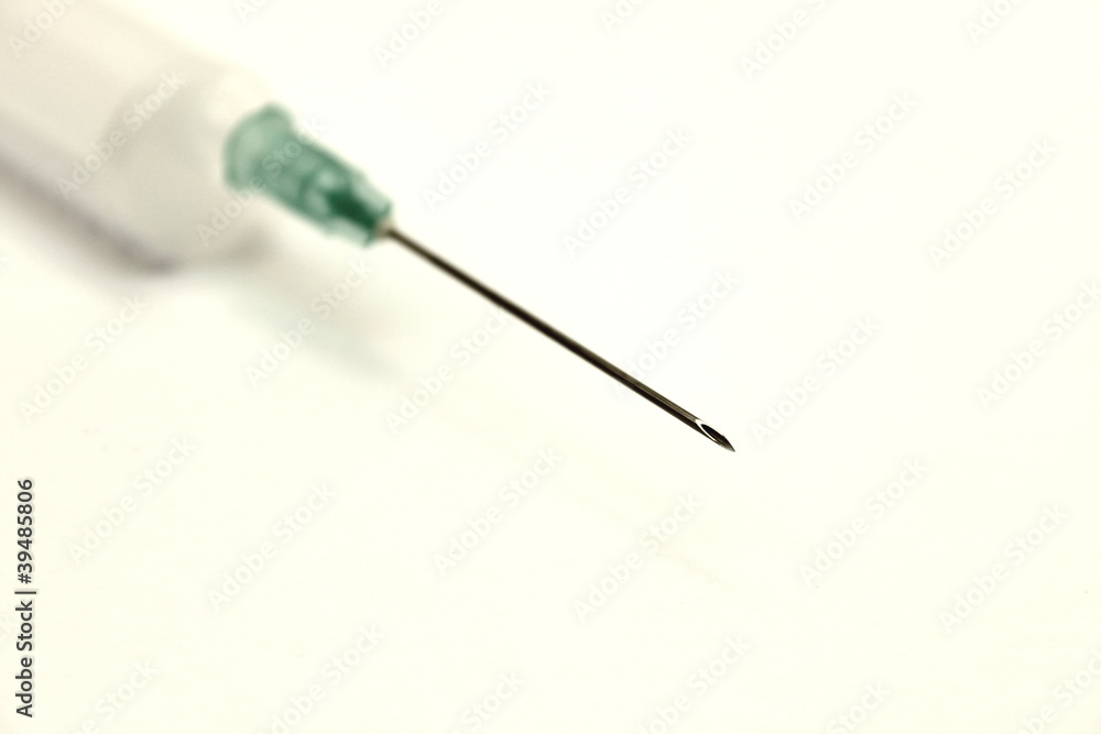 Medical needle with a syringe on a white background Medical needle with a syringe on a white background