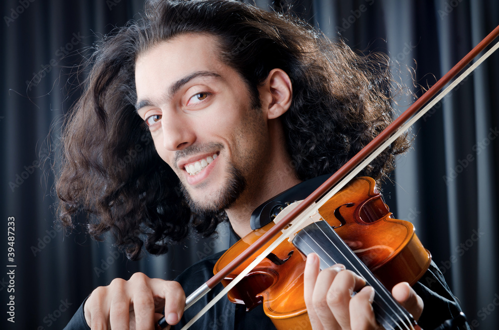 Fototapeta premium Violin player playing the intstrument