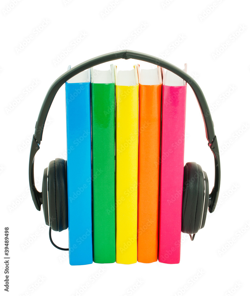 Row of books and headphones - Audiobooks concept