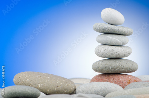 Pebbles stack against gradient background