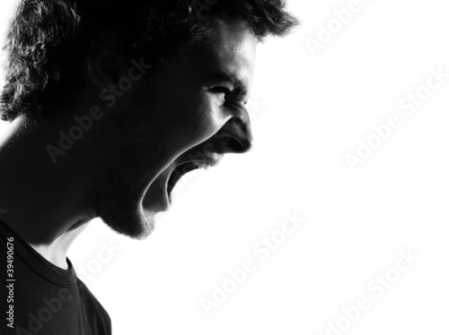 Fotografie young man silhouette screaming angry portrait
