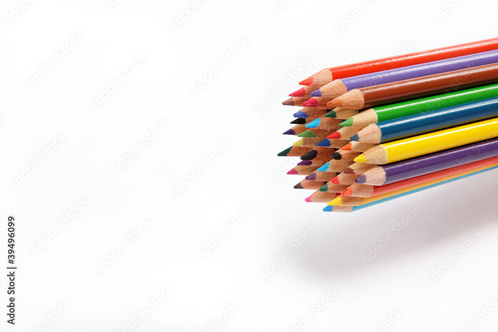 Colored pencils on a white background. Colored pencils on a white background.