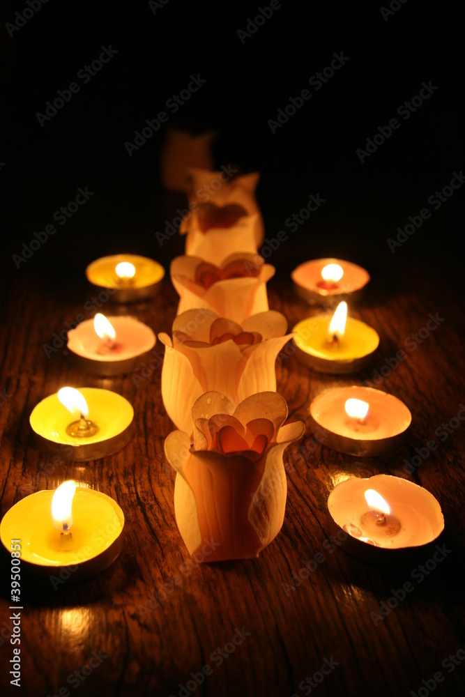 Candles and buds of roses Candles and buds of roses