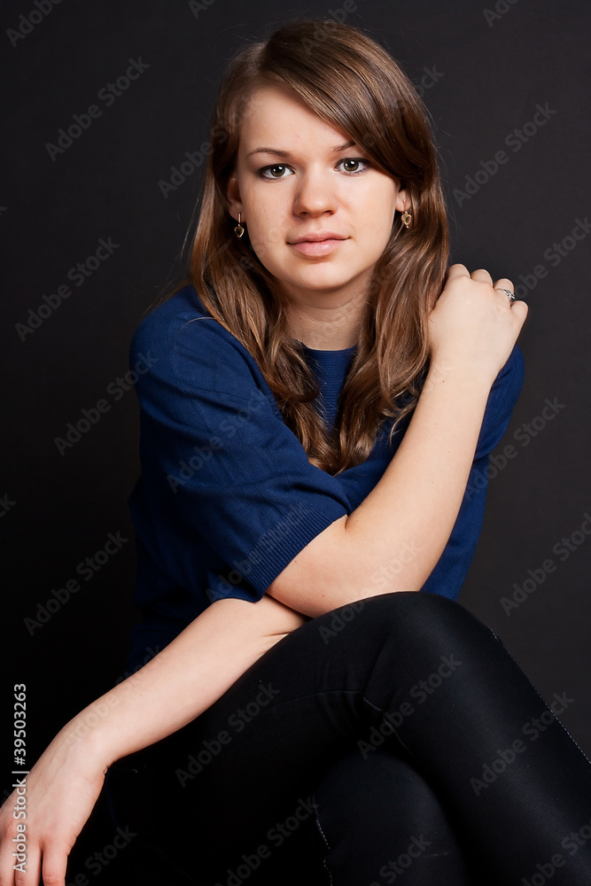 A beautiful girl with long hair looking at camera A beautiful girl with long hair looking at camera