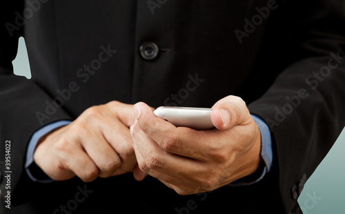 Businessman touch smart phone in hand