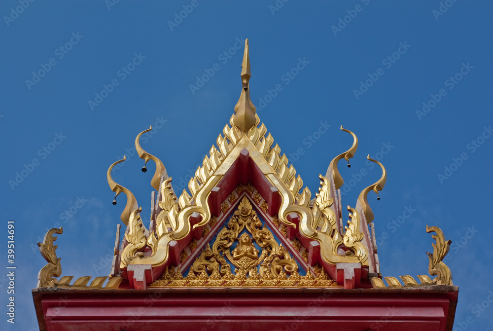 Fototapeta premium Buddhist temple gable with carved apex