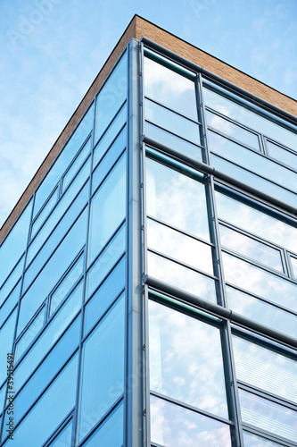 Office building reflecting the sky