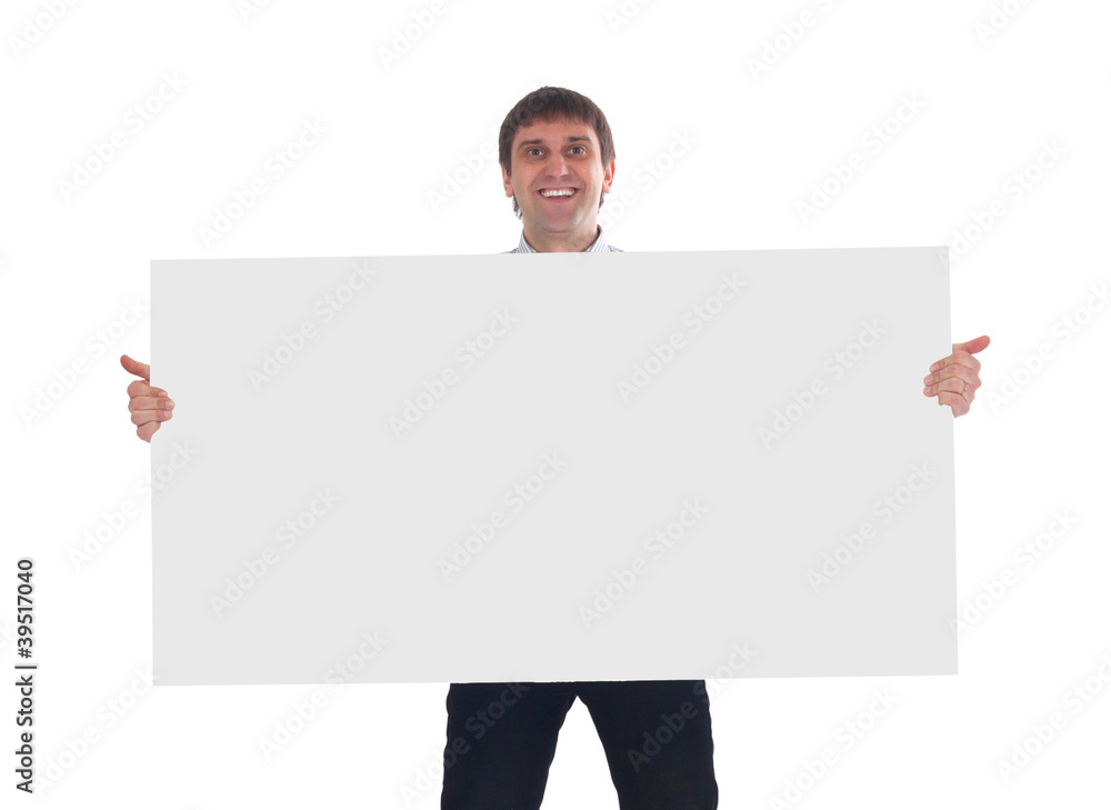 Happy smiling young business man showing blank signboard Happy smiling young business man showing blank signboard