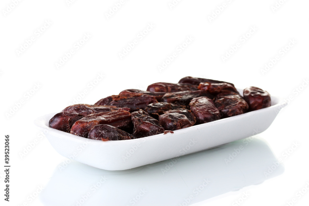 delicious dried dates in packaging isolated on white delicious dried dates in packaging isolated on white