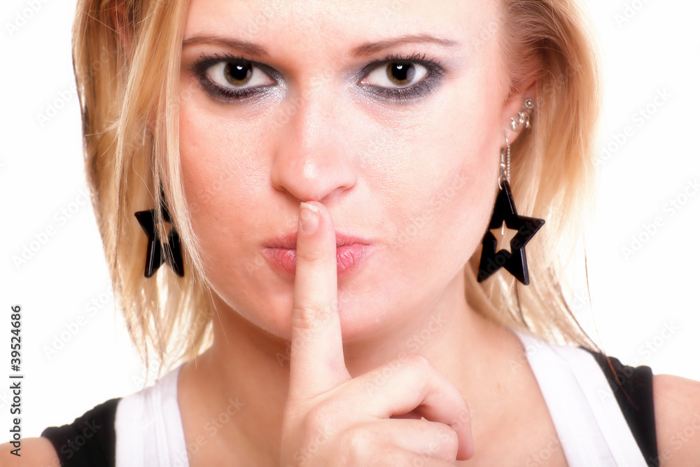 Naklejka premium Young girl asking for silence finger