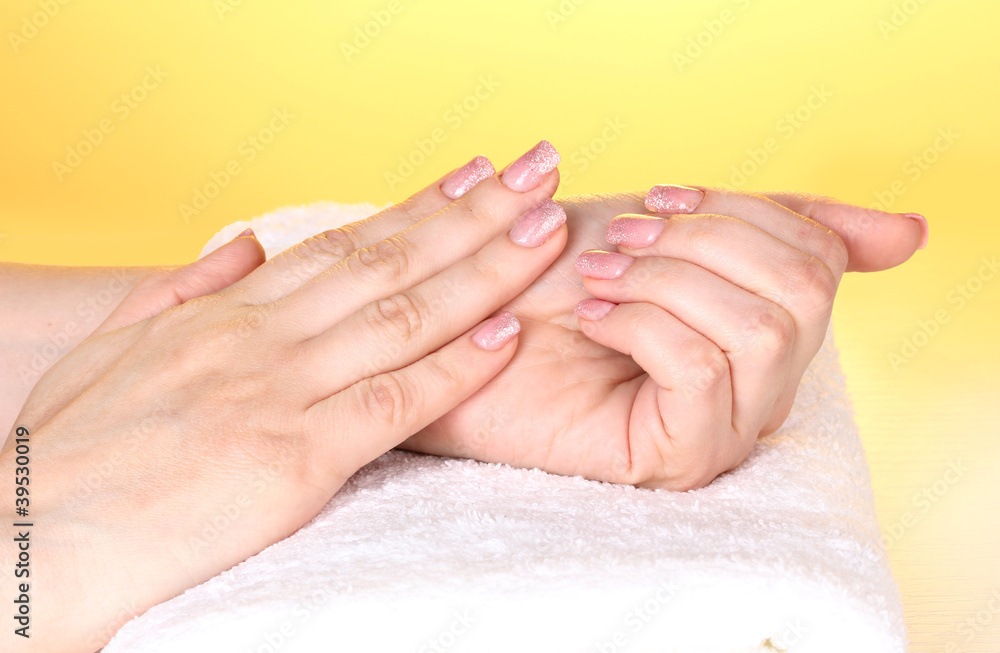 Female hands on towel