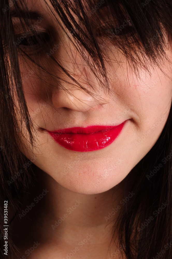 Closeup photo of a woman with red lips Closeup photo of a woman with red lips