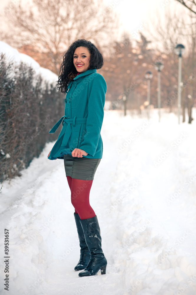 Portrait of beautiful girl walking in the snow. Portrait of beautiful girl walking in the snow.
